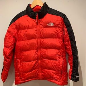 Boys The North Face 550 jacket - red with black detail.